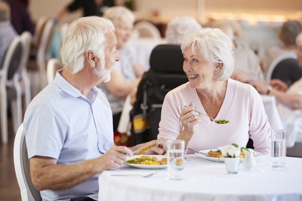 Two independent living residents enjoy nutritious lunch